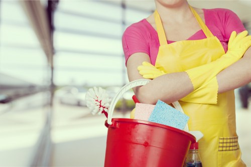 Local gutter cleaning service working on a commercial property in N2
